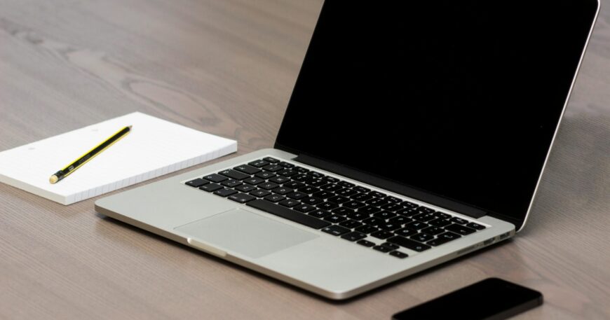 Free Silver Macbook Beside Iphone Stock Photo