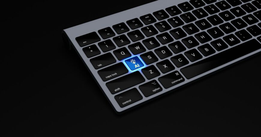 a black keyboard with a blue button on it